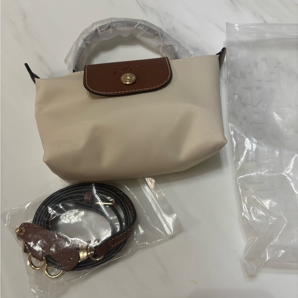Longchamp Handbags - Longchamp Beige Nylon Mini Crossbody with Brown Trim